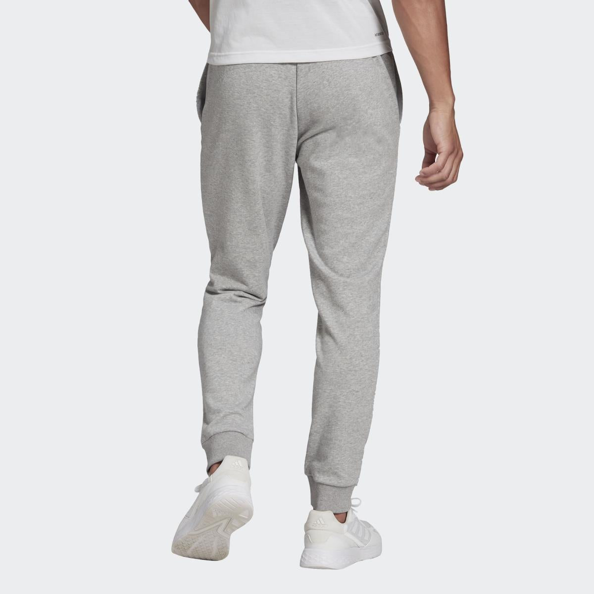 Pantaloni da tuta Essentials 3-Stripes GM1091 UNI ADIDAS 